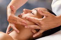 a woman getting a massage in a spa